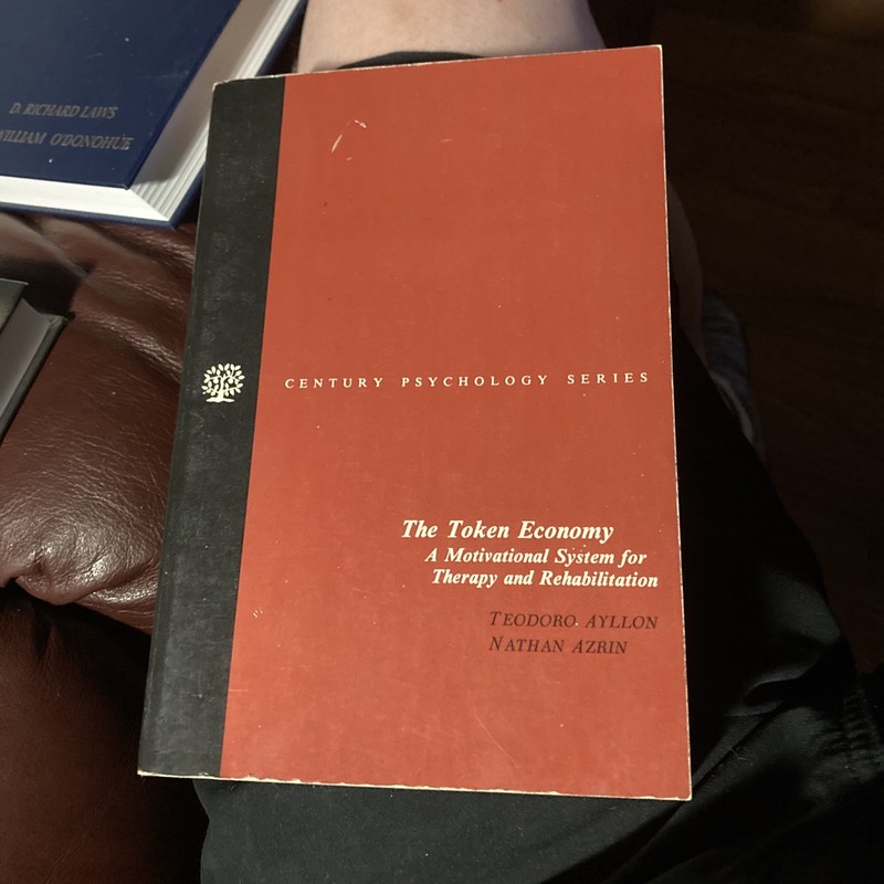 THE TOKEN ECONOMY: A MOTIVATIONAL SYSTEM FOR THERAPY AND By Teodoro Ayllon