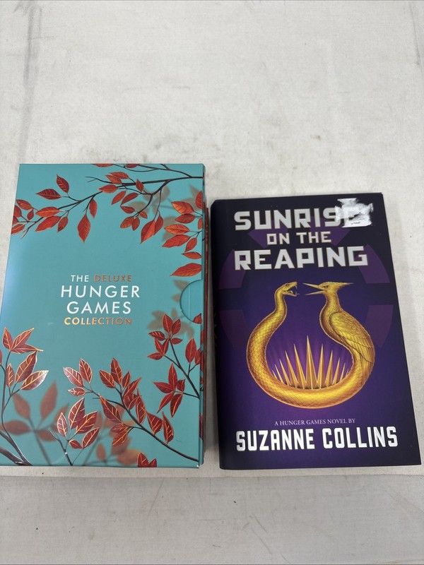 The Deluxe Hunger Games collection paperback + hard cover sunrise on the reaping