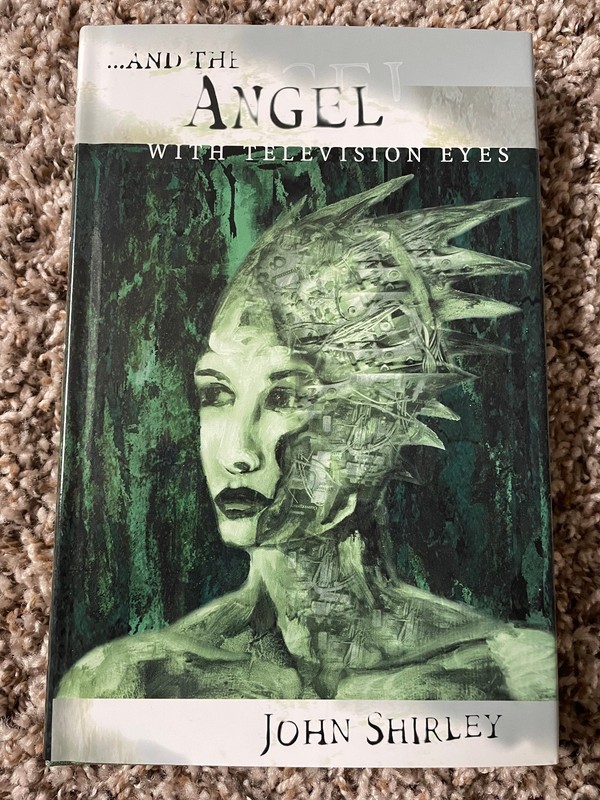 …AND THE ANGEL WITH TELEVISION EYES (2001) John Shirley 1st trade hardcover OP
