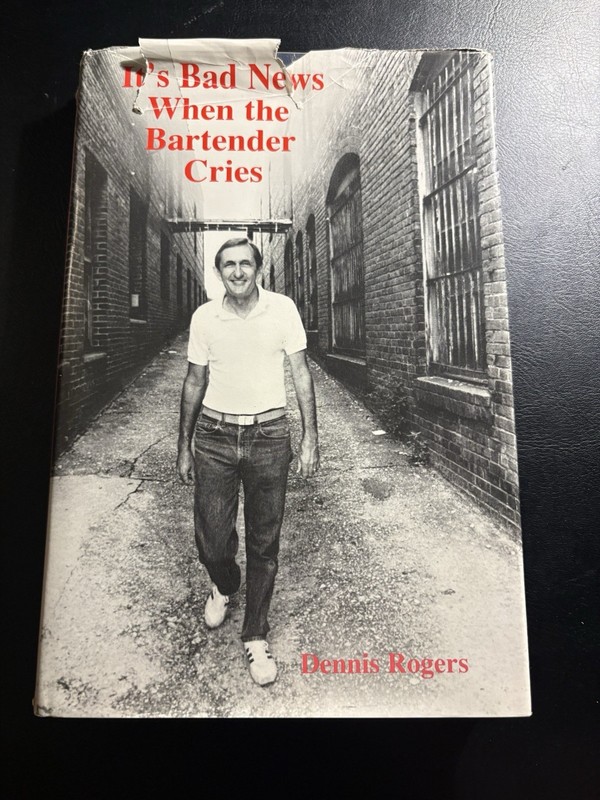 It’s Bad News When the Bartender Cries Dennis Rogers Signed Inscribed 1988 HC