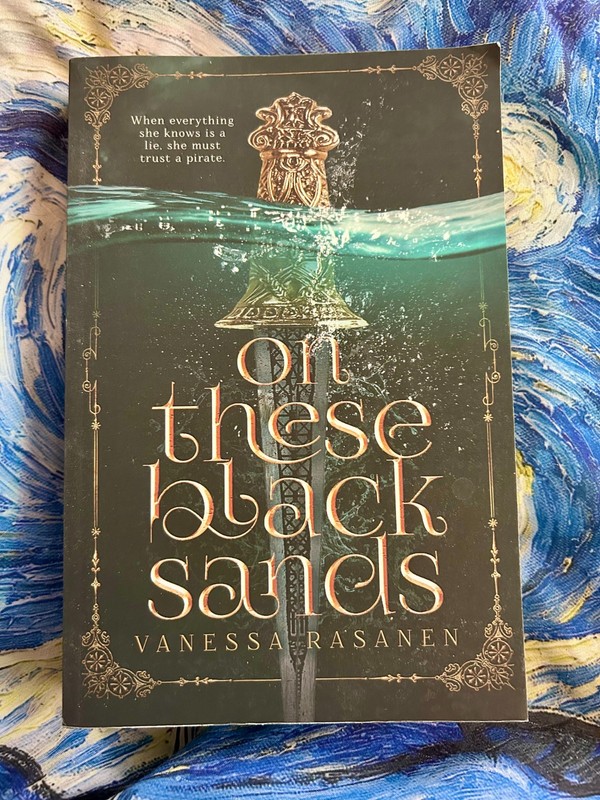 ON THESE BLACK SANDS VANESSA RASANEN PAPERBACK BRAND NEW ***FREE SHIPPING***